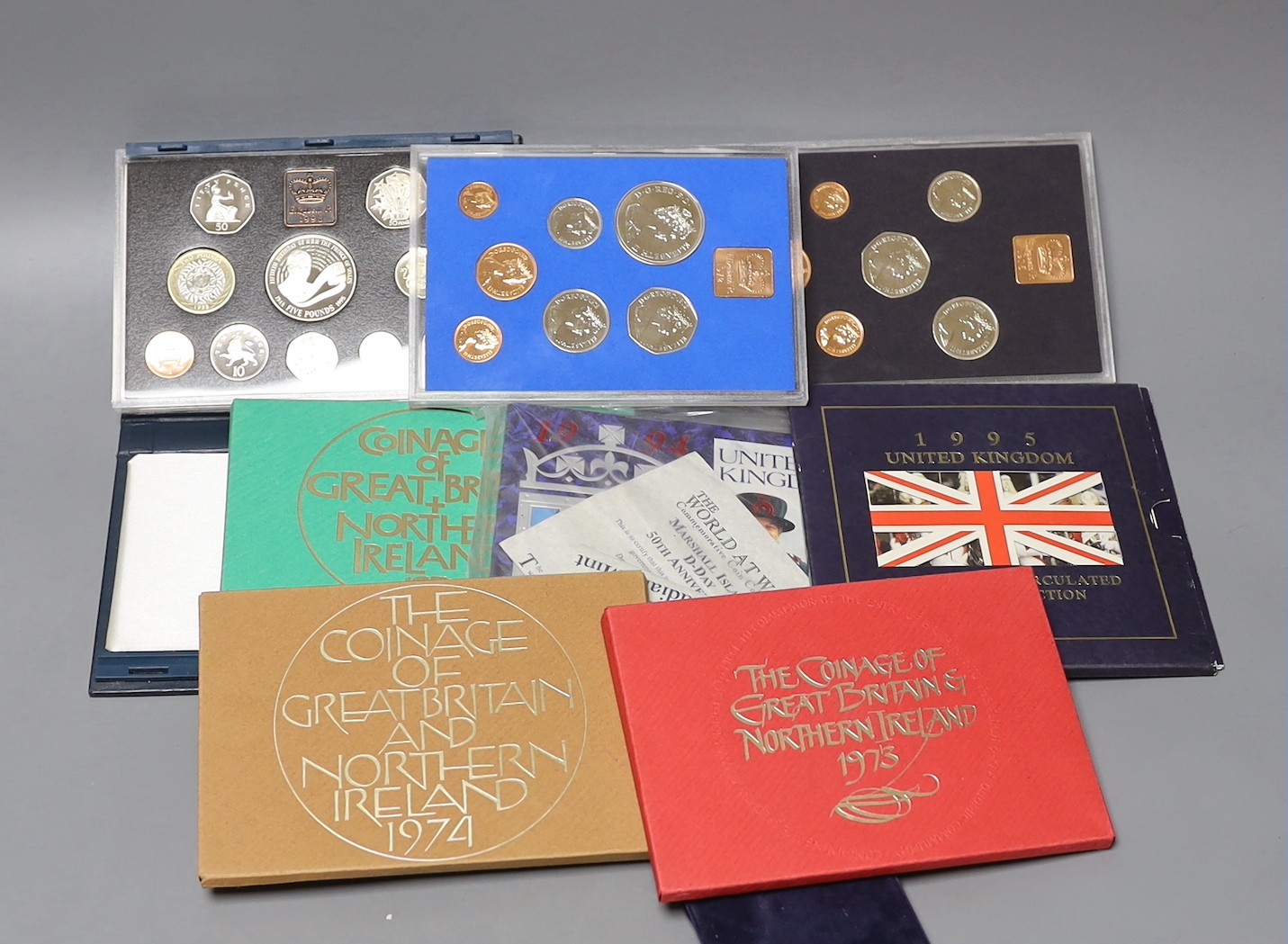 A group of UK Royal Mint BU year sets.